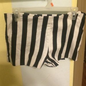 Black and white striped shorts. Not too short.