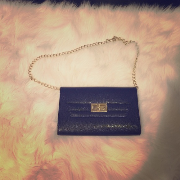 Black Aldo clutch with gold hardware