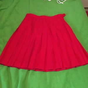 Bright red pleated skirt