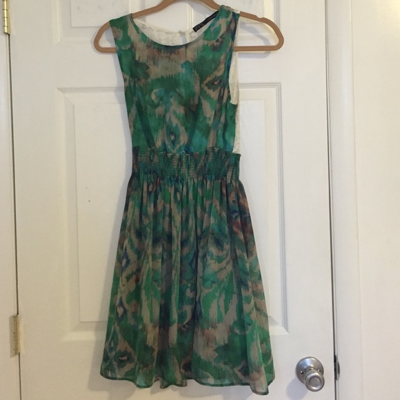 Flirty green patterned dress with lace back