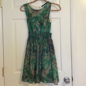 Flirty green patterned dress with lace back