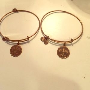 Two fleur di lis charm bangles