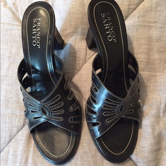 Black high heels. White stitching.