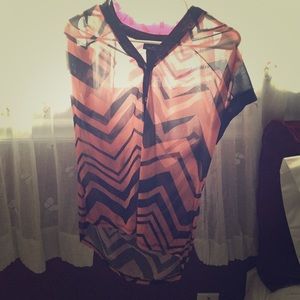 Salmon and black chevron shirt.