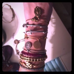 Bundle of charm bangles and wrap bracelets