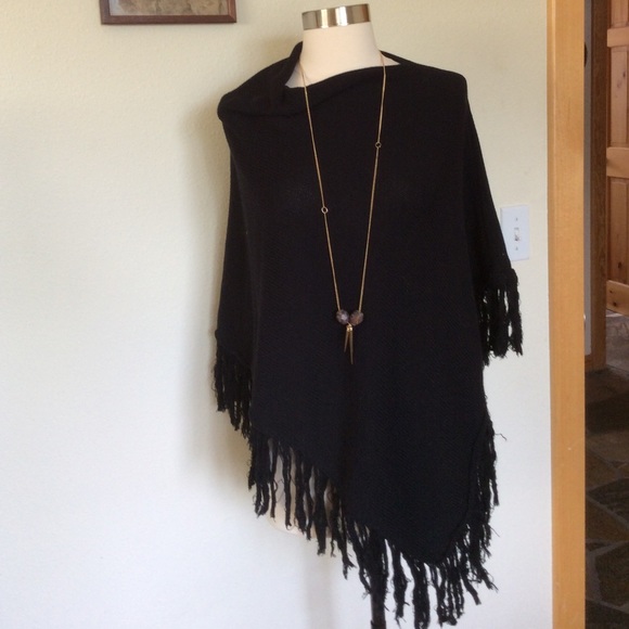 Black sweater poncho with fringe