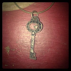 Silver embellished key necklace.