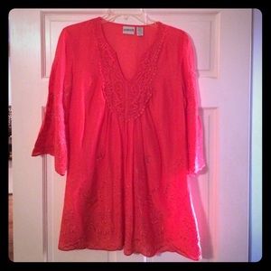 Coral color tunic.