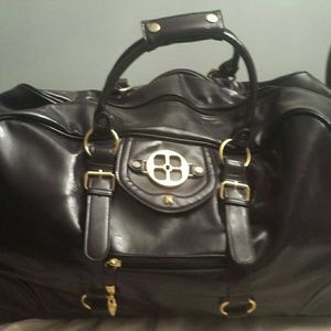 IMAN LUGGAGE ROLLING TRAVEL BAG PLUM