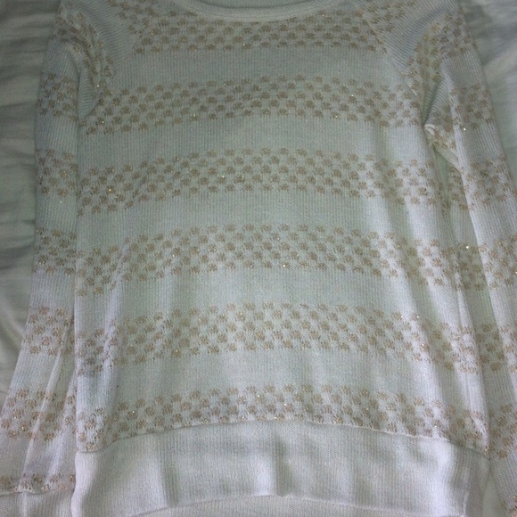 White and gold sweater