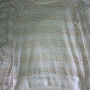 White and gold sweater