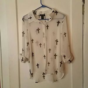White with black crosses, see through shirt.