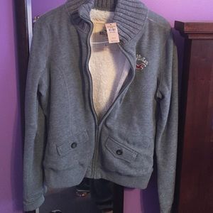 A grey hollister sweater with soft fur