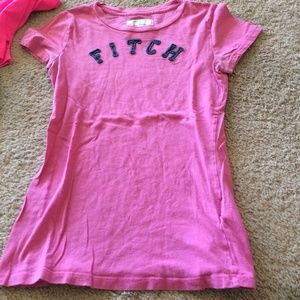 a soft pink shirt