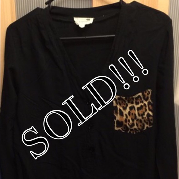 Black top with animal print pocket