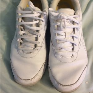 White Reebok athletic shoes