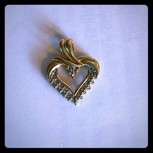 Heart Shape Pendant 10k gold, One diamond accent.
