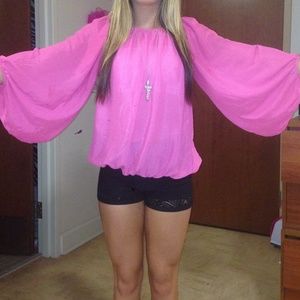 Boutique style top.Size small or medium. Fits both