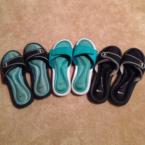 3 pairs of Nike slides