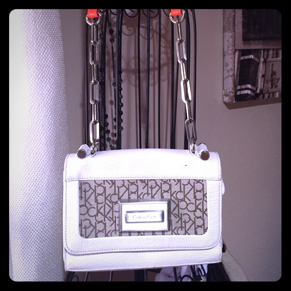 Calvin Klein bag with long orange accent strap