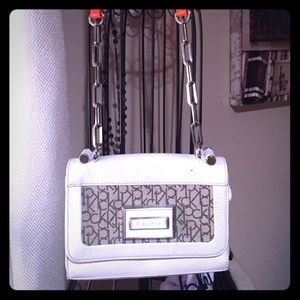 Calvin Klein bag with long orange accent strap
