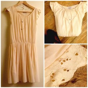 Pleated cream dress.