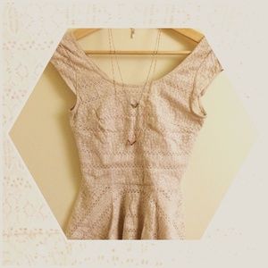 Ivory lace top with open back.