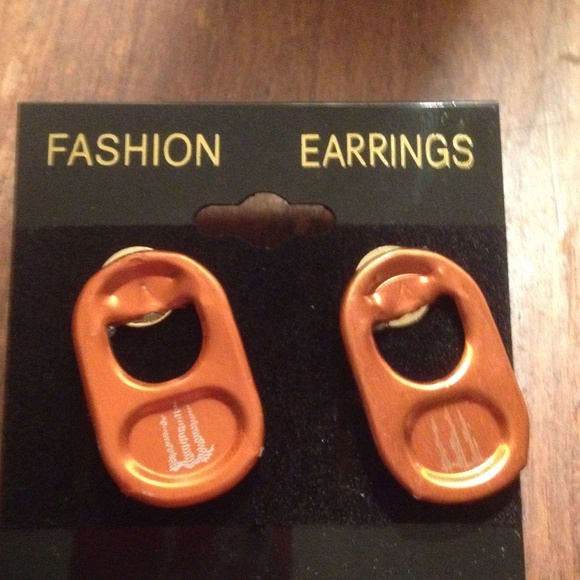 Homemade orange monster tab earrings.