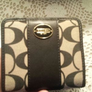Black and tan coach wallet