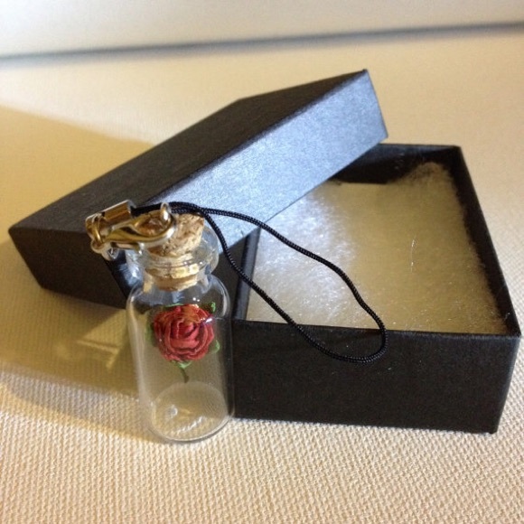 Rose in bottle with strap