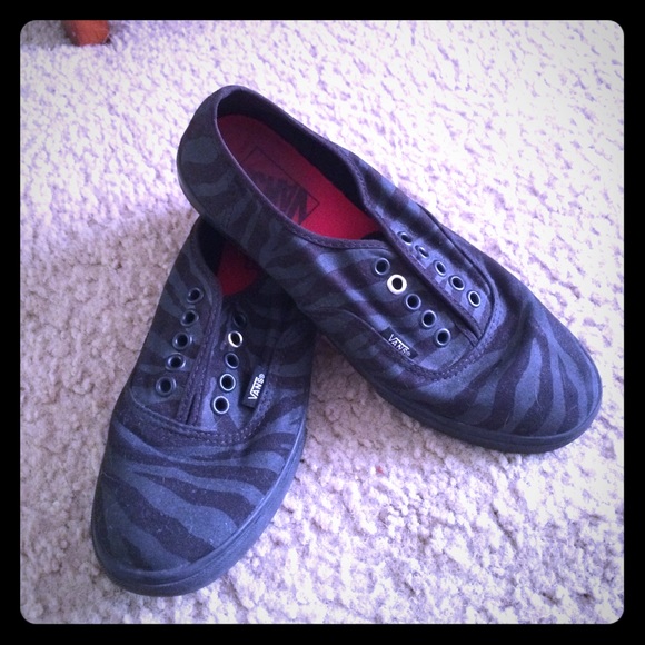 Black zebra striped vans.