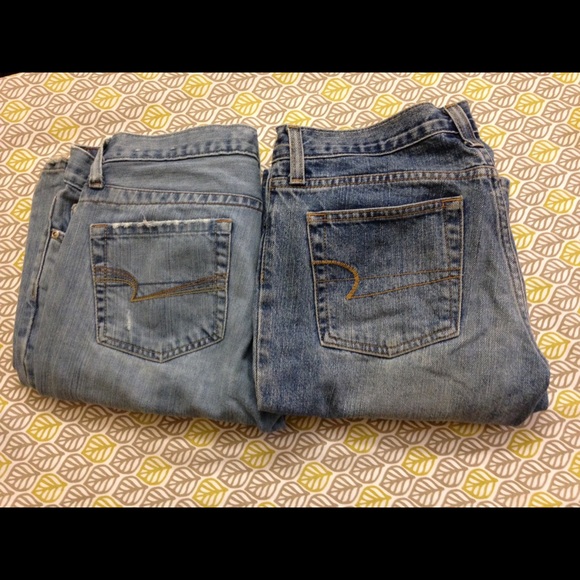 Two pairs light wash boot cut AE jeans