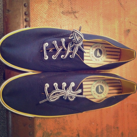Navy blue and yellow Sperry's Top Siders.