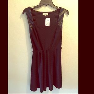 Cute little black dress with a little leather!