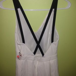 White dress with black straps that cross in back