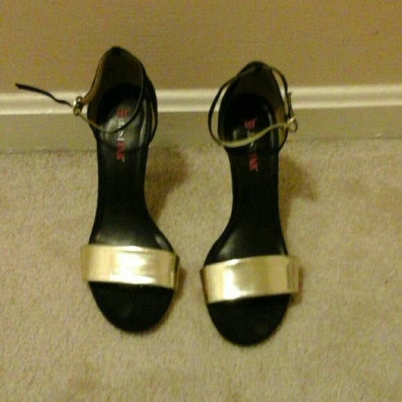 Black and gold sandal with ankle strap