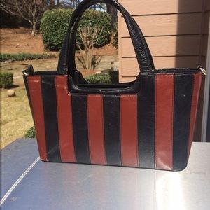 A black and red leather bag