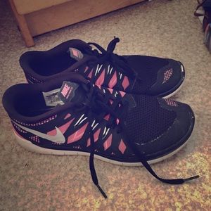 Pink and black nike frees