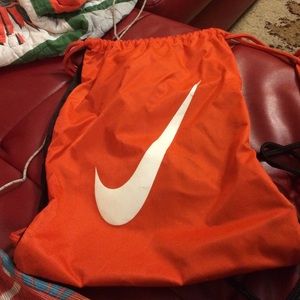 Orange draw string back pack
