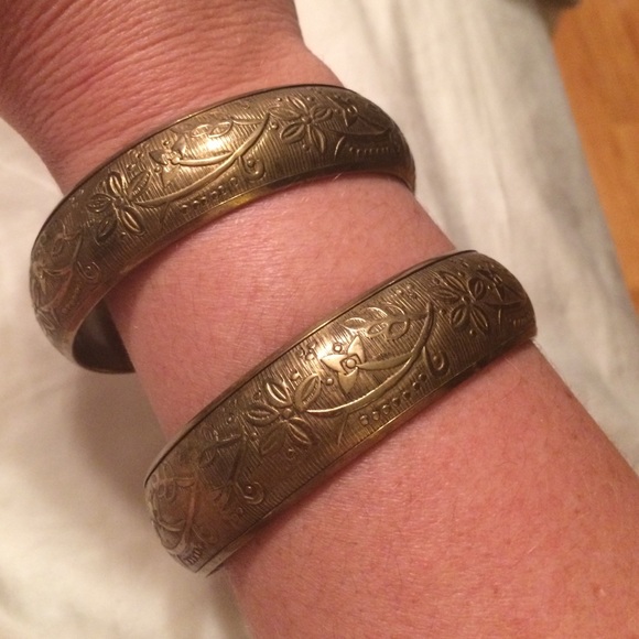 Two matching gold cuffs