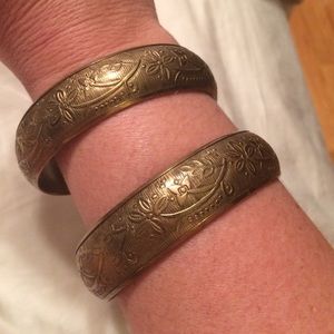 Two matching gold cuffs