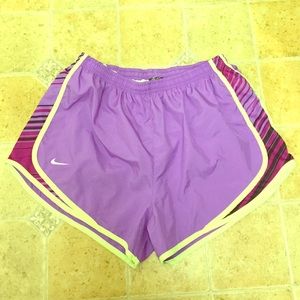 Purple and yellow Nike dri-fit running shorts