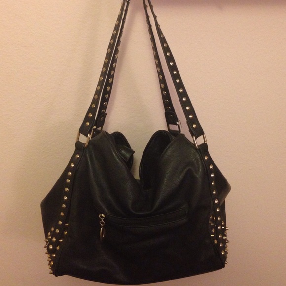 Studded faux leather bag with cheetah lining