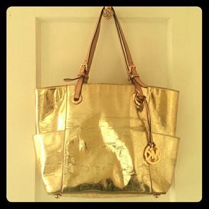 Gold Michael Kors logo purse
