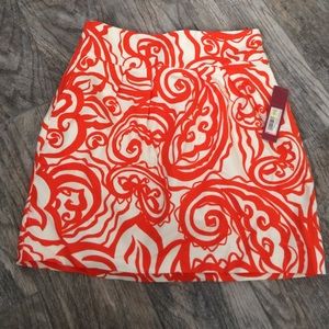 Orange and cream elastic waist skirt with pockets.
