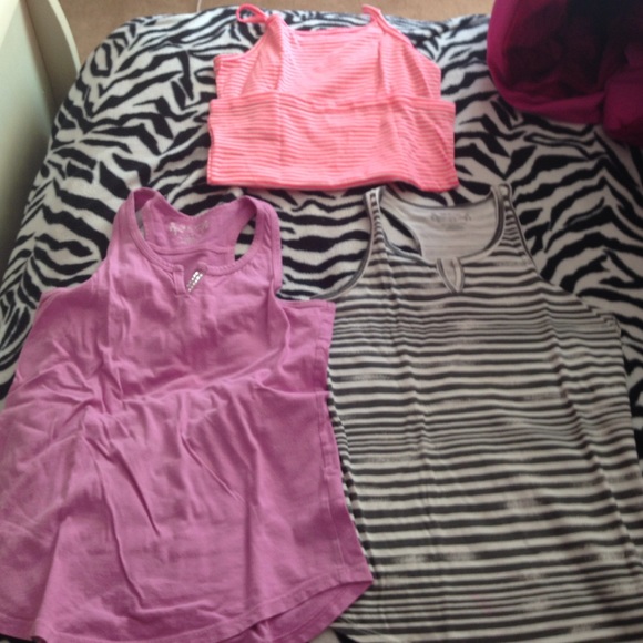 2 sleeveless shirts and 1 tanktop