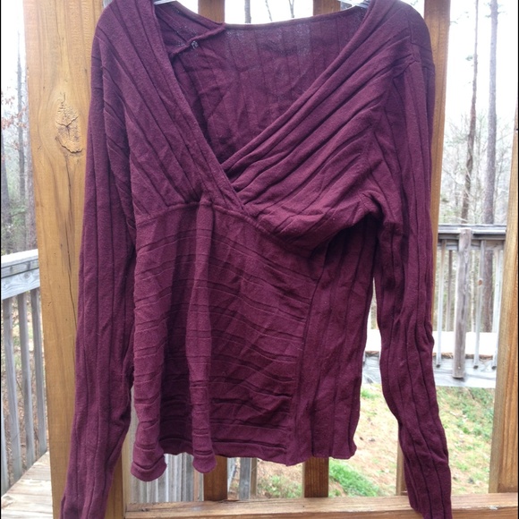 Maroon colored long sleeved top