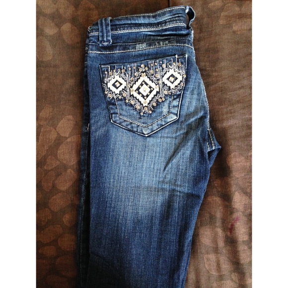 Jeans with studded back pockets