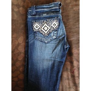 Jeans with studded back pockets