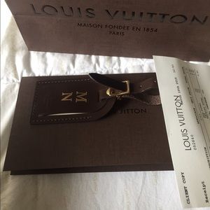 LV luggage tag.. New with bag and receipt.